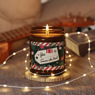 Amber jar candles with a festive holiday theme, showcasing five scent options: Christmas Warmth, Cinnamon Vanilla, Coconut Cream + Cardamom, White Sage + Lavender, and Unscented. Each candle is made with 100% natural soy wax blend, a cotton wick, and comes in a charming amber glass jar, perfect for creating cozy, atmospheric holiday vibes.