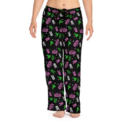 Women's Wicked-themed pajama pants featuring an all-over print of Glinda and Elphaba symbols, made from lightweight 100% polyester fabric with a relaxed fit, elastic waistband, and black drawstring tie. Cozy and stylish loungewear inspired by Wicked.