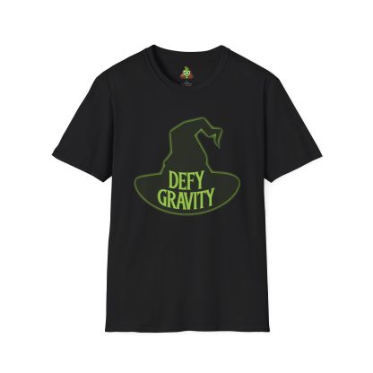 Unisex t-shirt with Elphaba's witch hat and the phrase 'Defy Gravity' printed in bold lettering. This soft, lightweight shirt features a classic fit, crew neckline, and durable twill-taped shoulders, perfect for fans of Wicked and those inspired to rise above challenges.