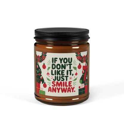 Holiday candle with the cheeky message 'If You Don’t Like It Just Smile Anyway' in festive amber glass jar. Available in scents like Christmas Warmth, Cinnamon Vanilla, Coconut Cream + Cardamom, White Sage + Lavender, and Unscented. Perfect for gifting or adding a cozy ambiance to your space.