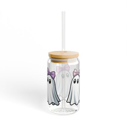 Cute ghost in a white sheet wearing pink bow on a 16oz sipper glass.