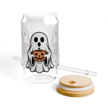 Cute ghost in a white sheet holding a jack-o-lantern on a 16oz sipper glass.